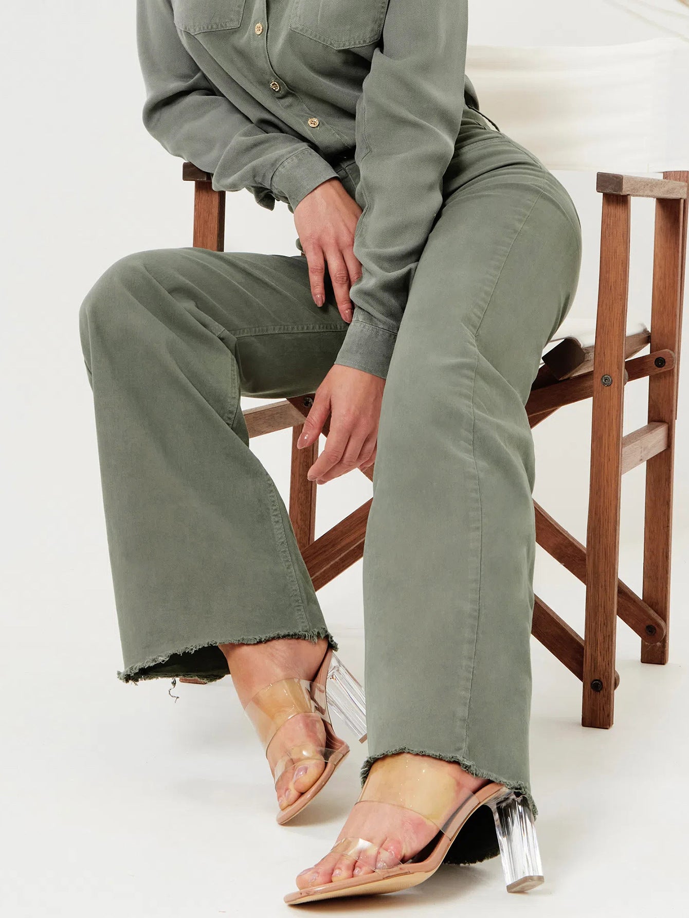 Olive green denim jumpsuit with clear heels in women’s fashion ملابس for a stylish look