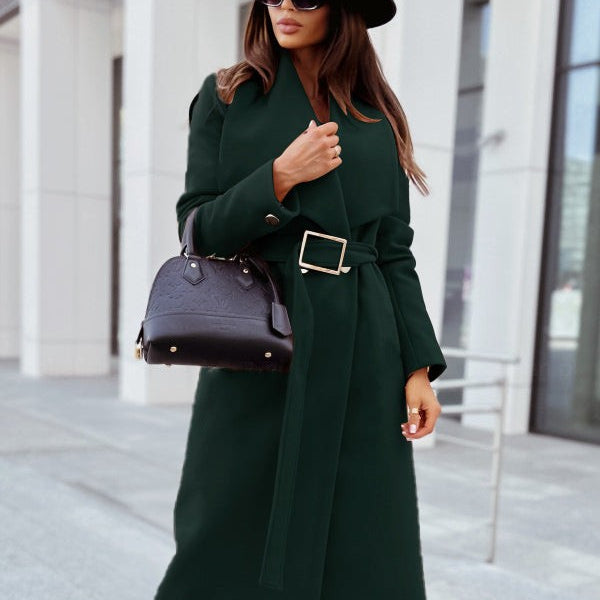 Elegant button coat showcasing woman in a green woolen long sleeve button coat