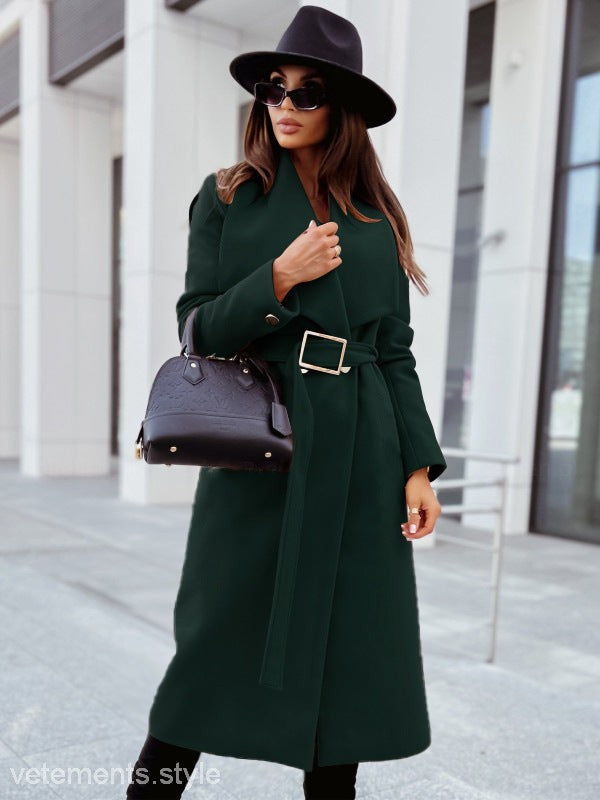 Elegant button coat showcasing woman in a green woolen long sleeve button coat