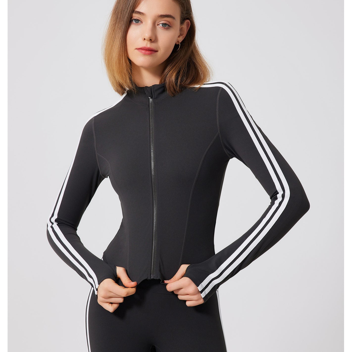 Black adidas tracksuit with white stripes and running skin friendly zipper