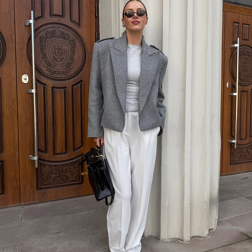 Langry fashion gray textured blazer with white pants and black accessories
