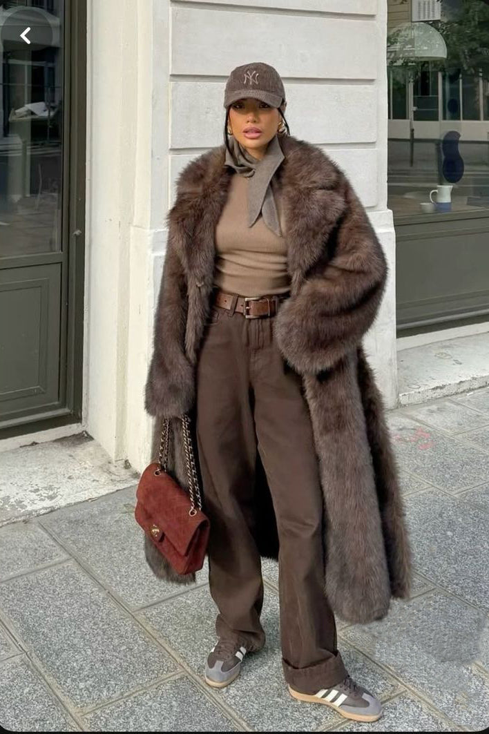 Brown faux fur vintage jacket with belt, cap, and Adidas sneakers