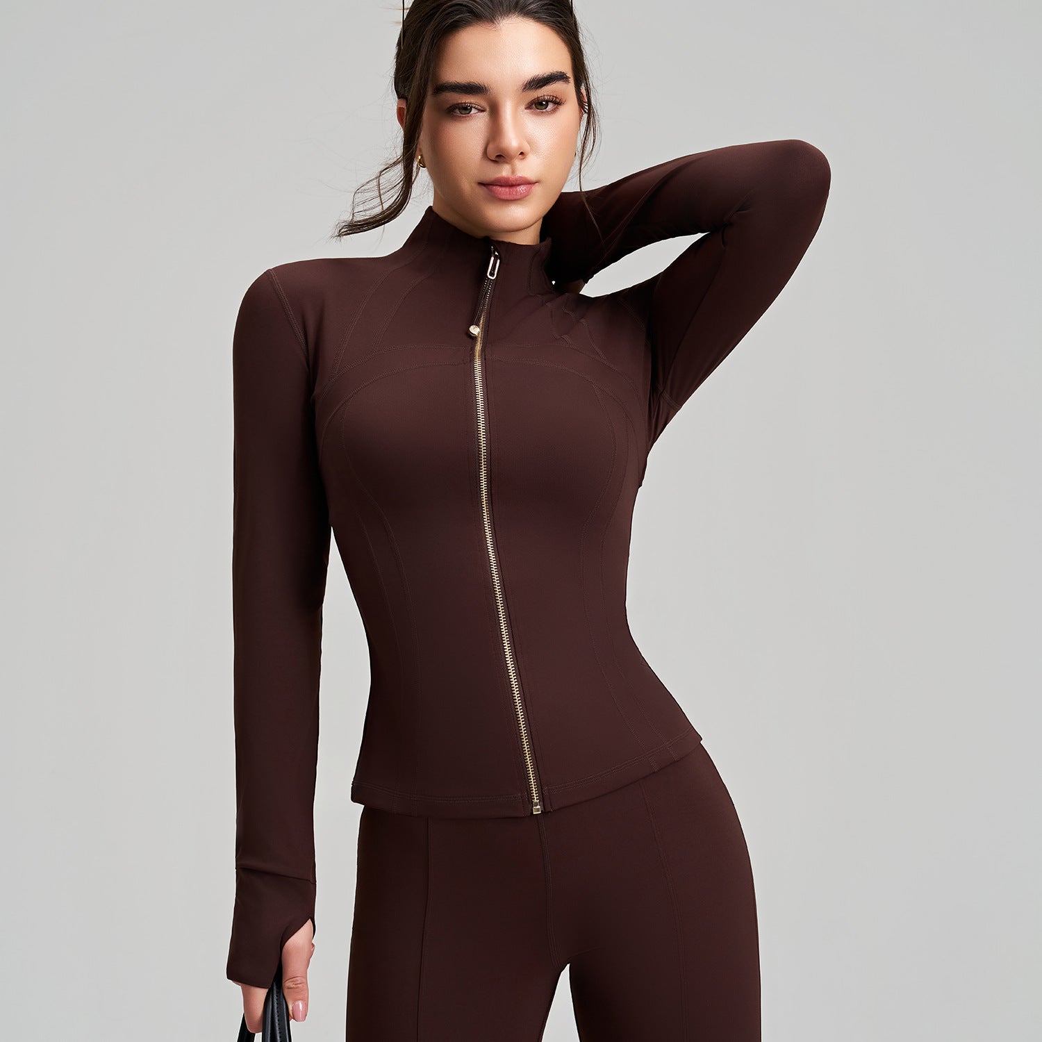 Brown long sleeve yoga jacket with finger stall stand collar and ribbed cuffs