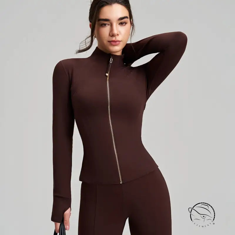 Brown long sleeve yoga jacket with finger stall, ribbed cuffs, stretchy fabric