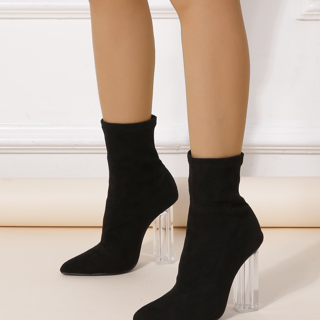 Black sock-style ankle boots with clear acrylic heels perfect for winter crystal heel mid boots