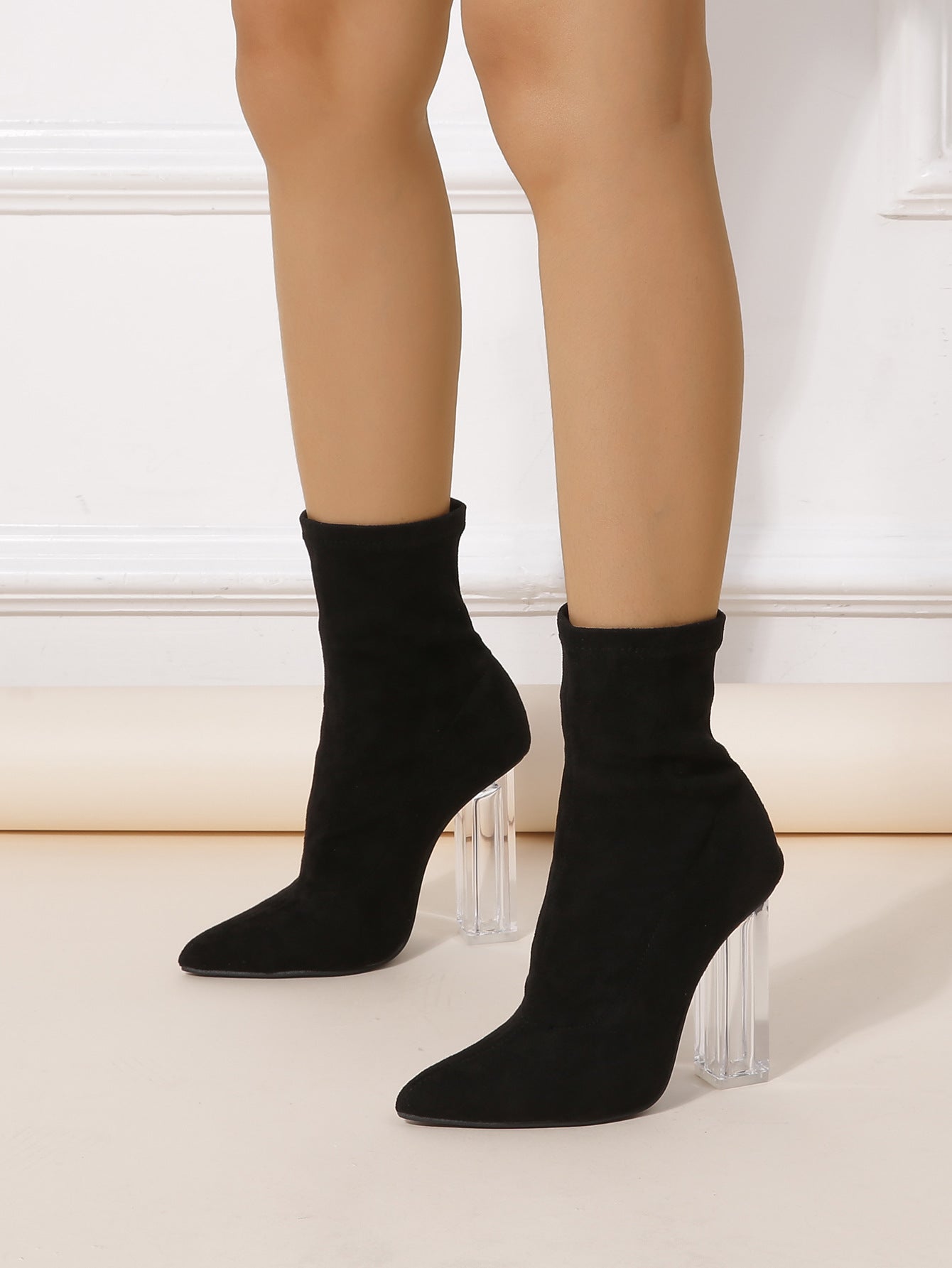 Black sock-style ankle boots with clear acrylic heels perfect for winter crystal heel mid boots