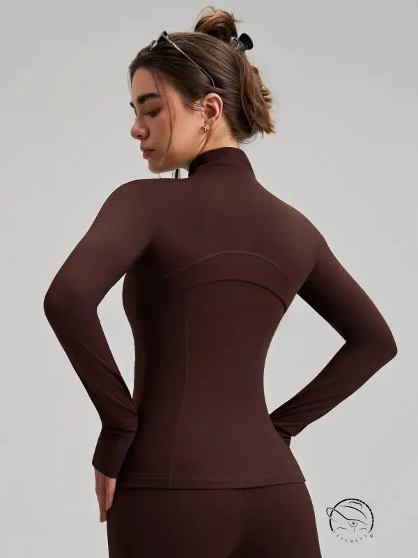 Brown long sleeve yoga jacket with high collar and finger stalls