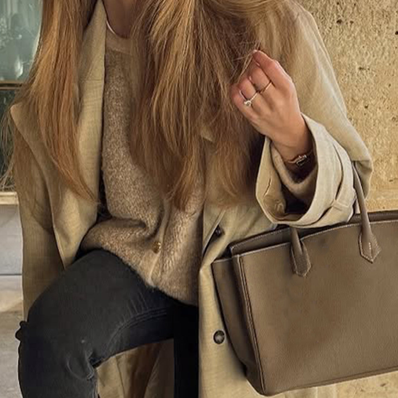 Beige leather tote bag with gold hardware and regular sleeve fashion design