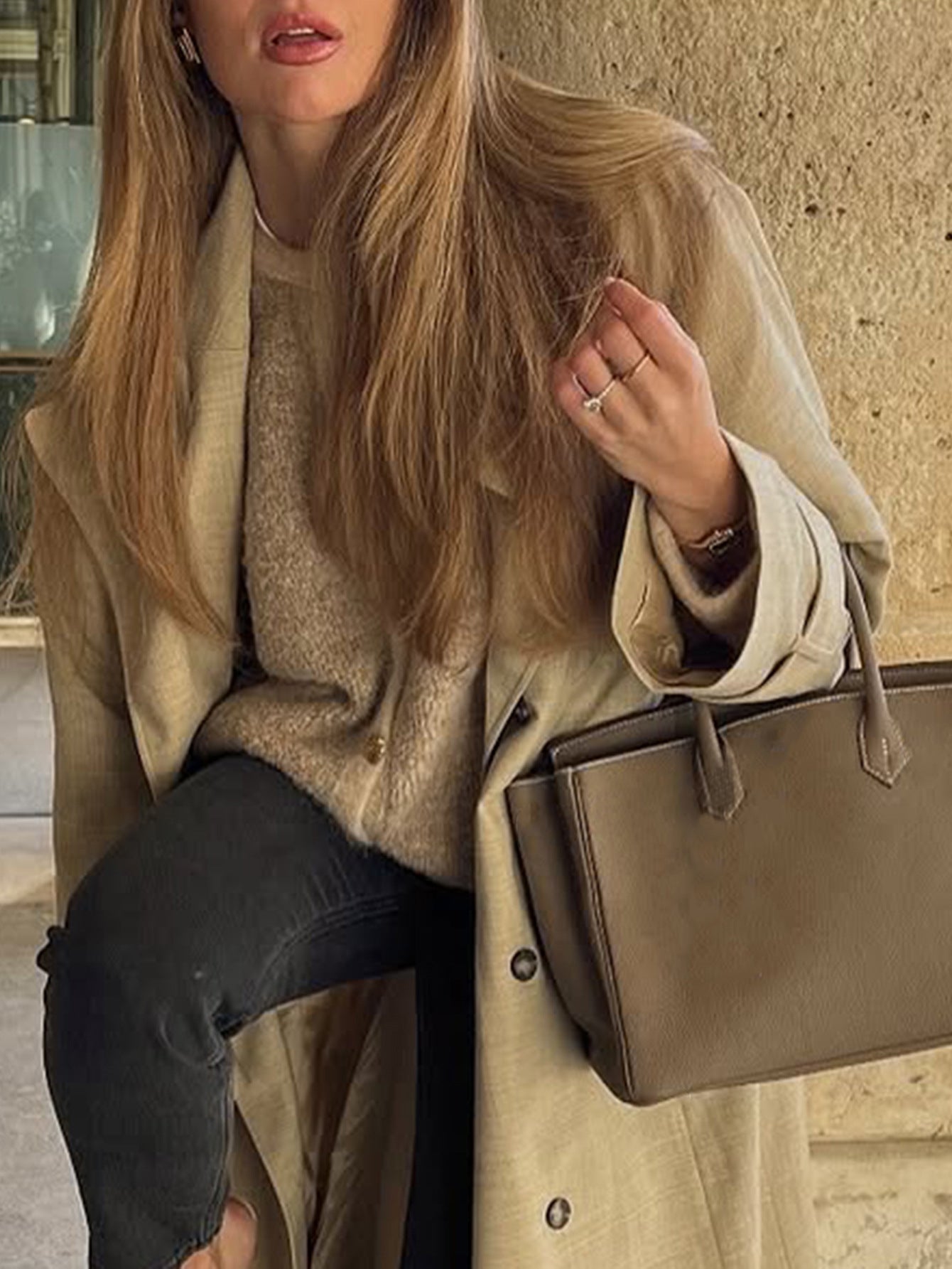 Beige leather tote bag with gold hardware and regular sleeve fashion design