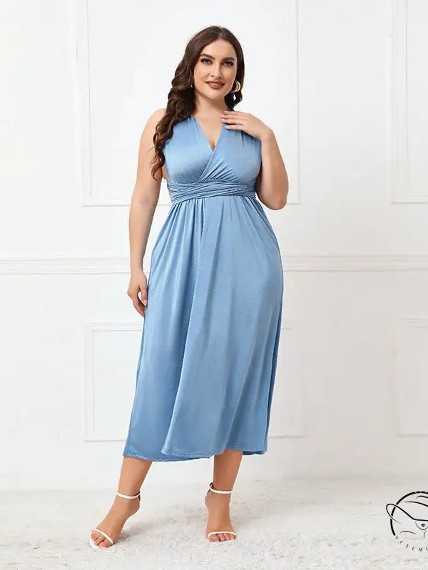 Woman in elegant cross backless lace up blue midi dress
