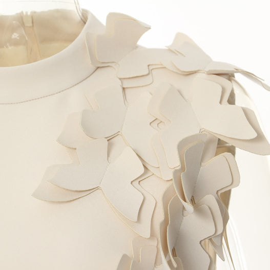 White winter butterfly shape evening dress with layered shoulder detail, perfect for fashion enthusiasts