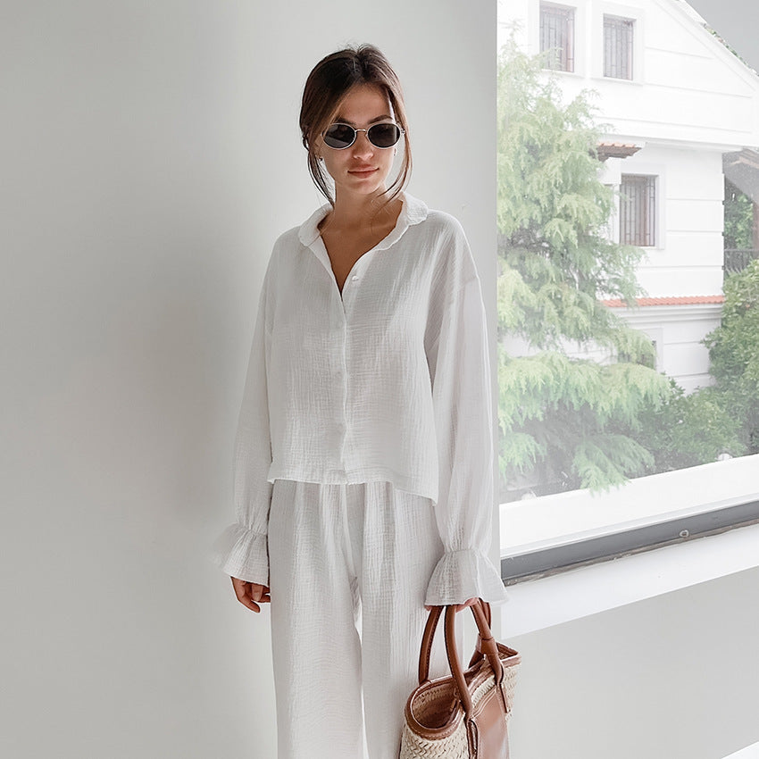 Woman in white pure cotton casual outfit with straw handbag for comfortable homewear