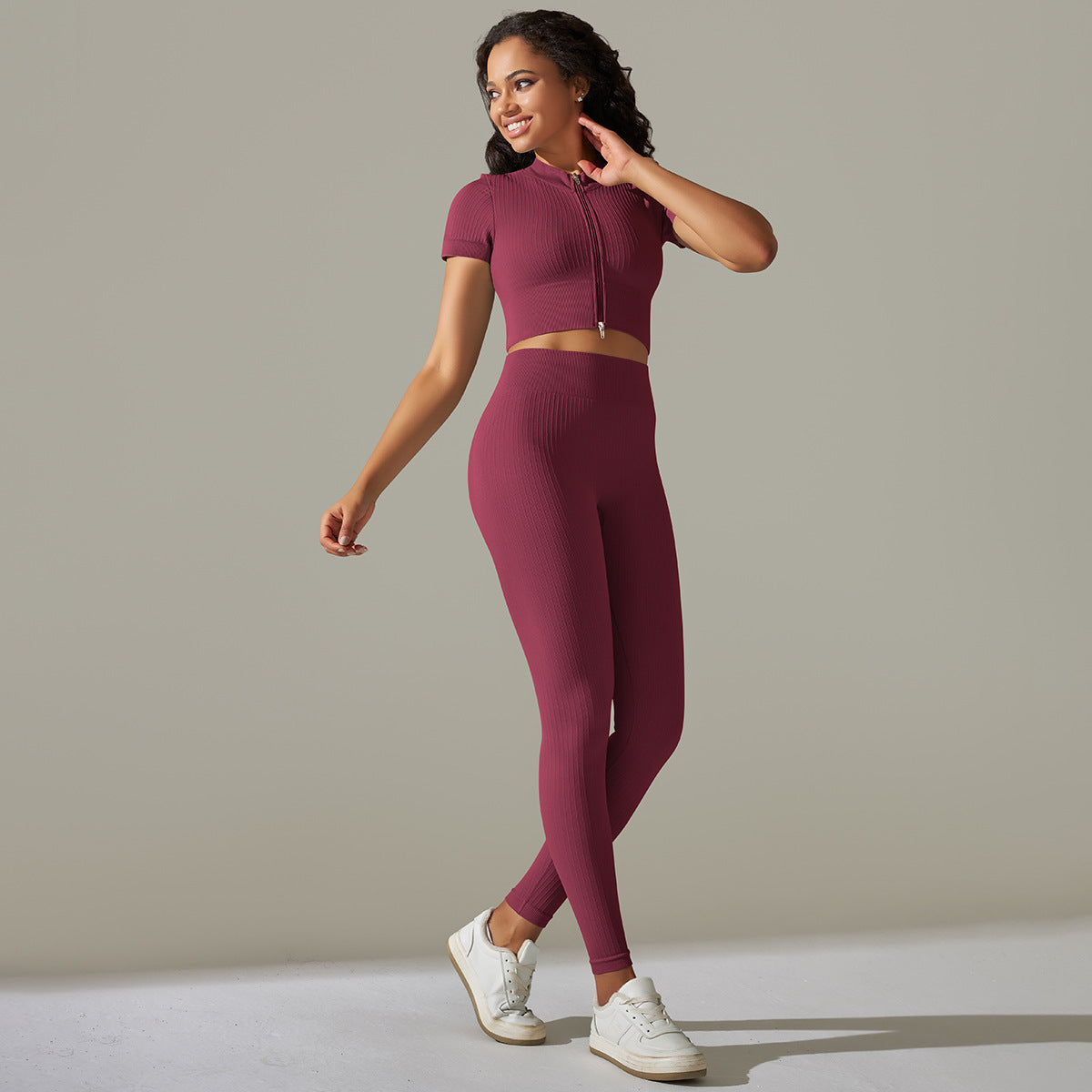 Seamless knitted peach burgundy athletic set with ribbed texture and high waist design