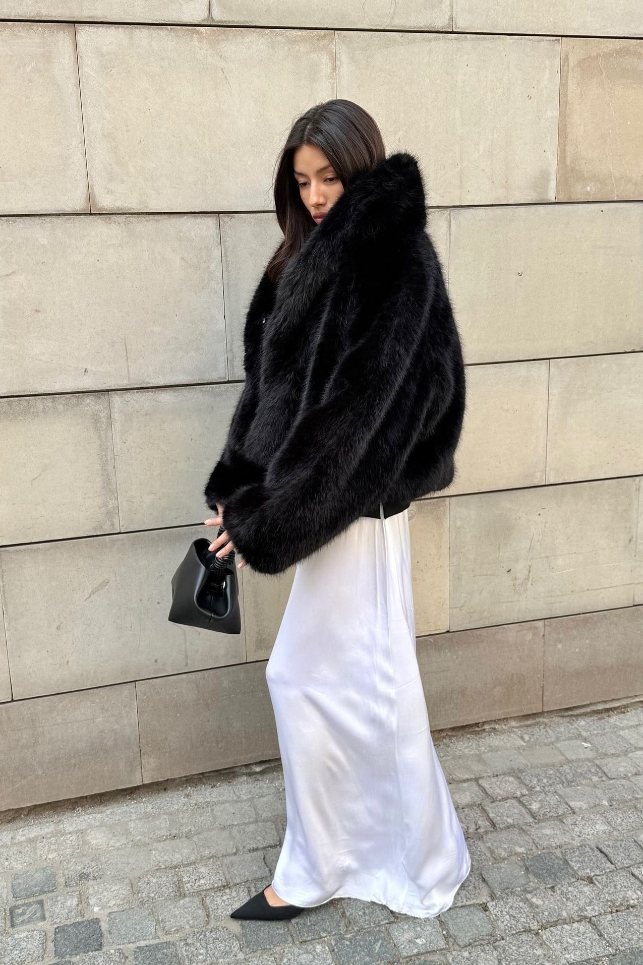 Luxurious black faux fur coat with fox collar from Prada