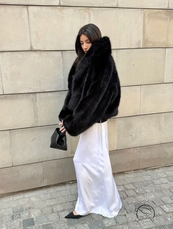 Cozy short faux fur coat with luxurious black texture and fox collar from Prada