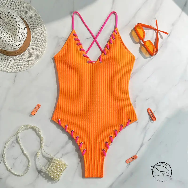 Stunning matching sling orange ribbed one-piece swimsuit