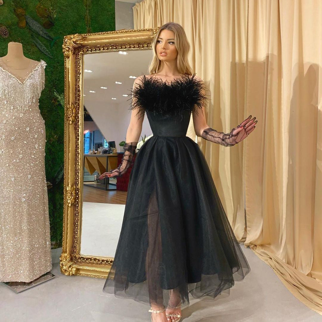 Elegant black feathered cocktail dress showcasing Langry fashion and tulle details