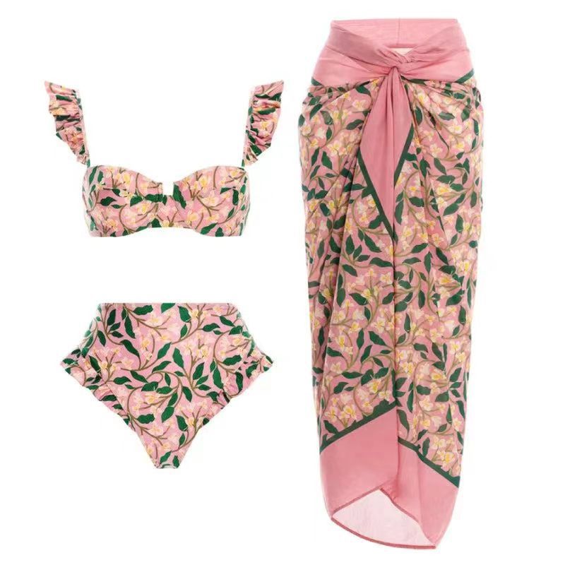 Pink floral print three-piece swimsuit set with sarong wrap for stylish beach fashion ملابس