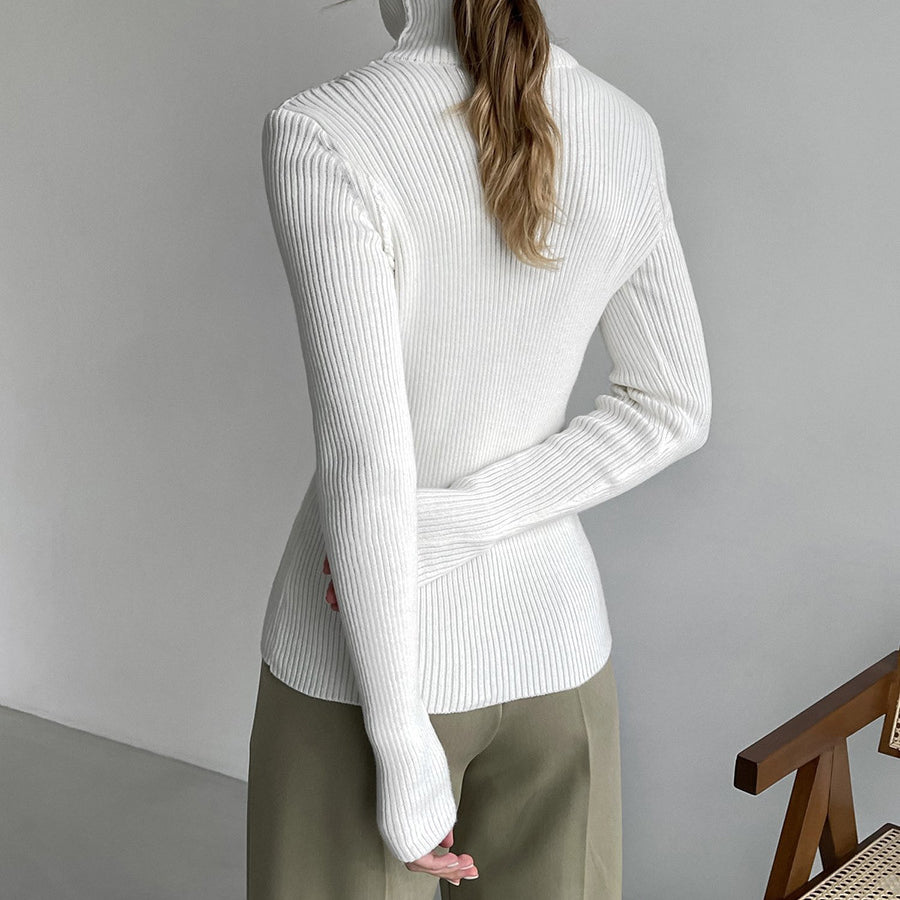 Langry fashion white ribbed turtleneck sweater with olive green pants