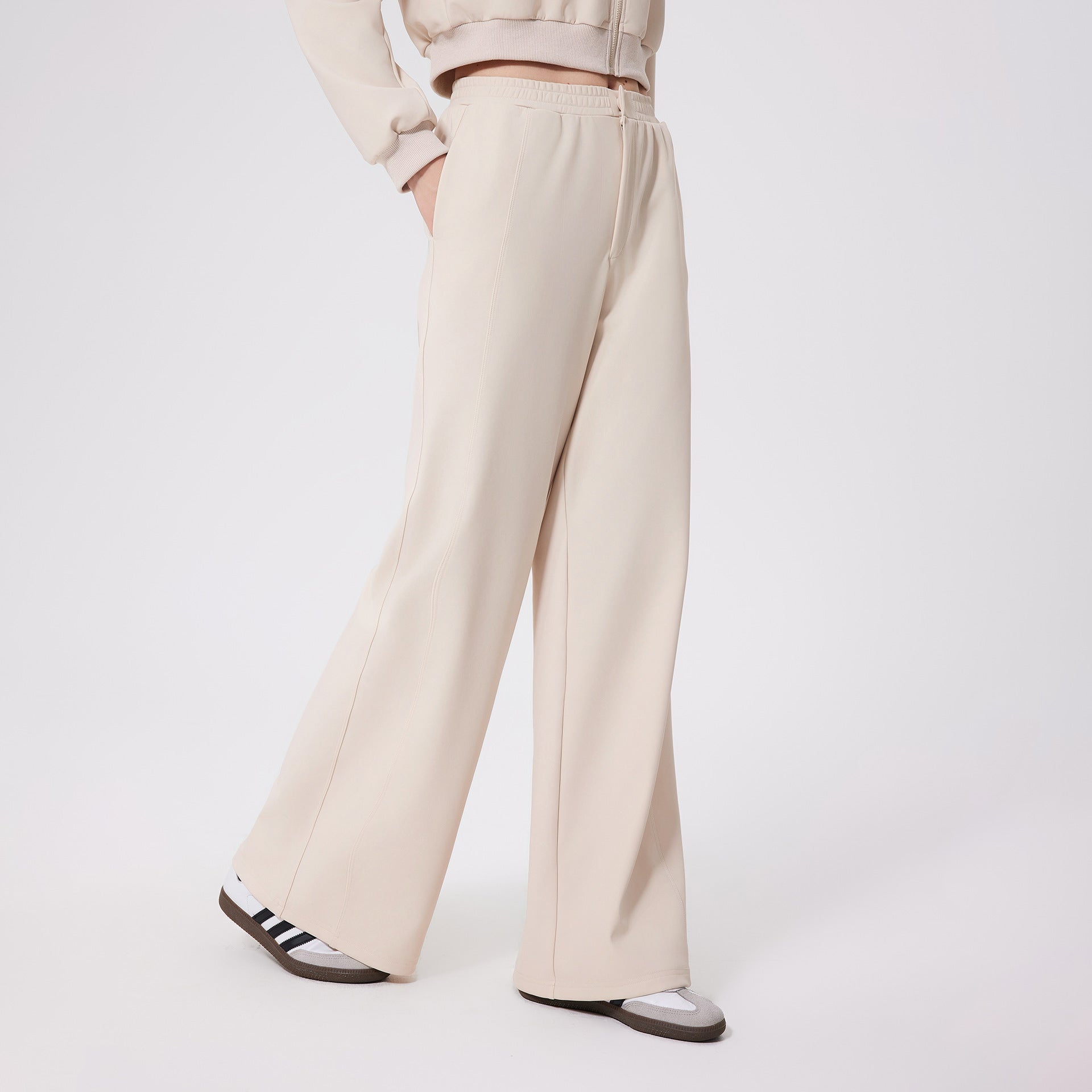 Cream-colored loose fitness warm pants with elastic waistband