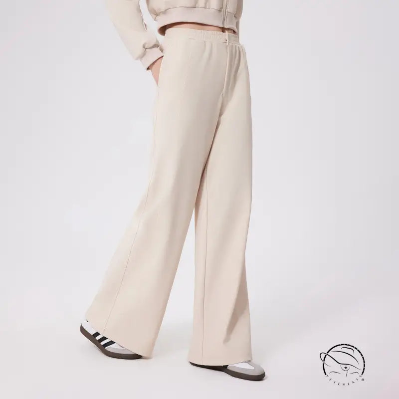 Cream-colored loose fitness warm pants with relaxed fit and elastic waistband