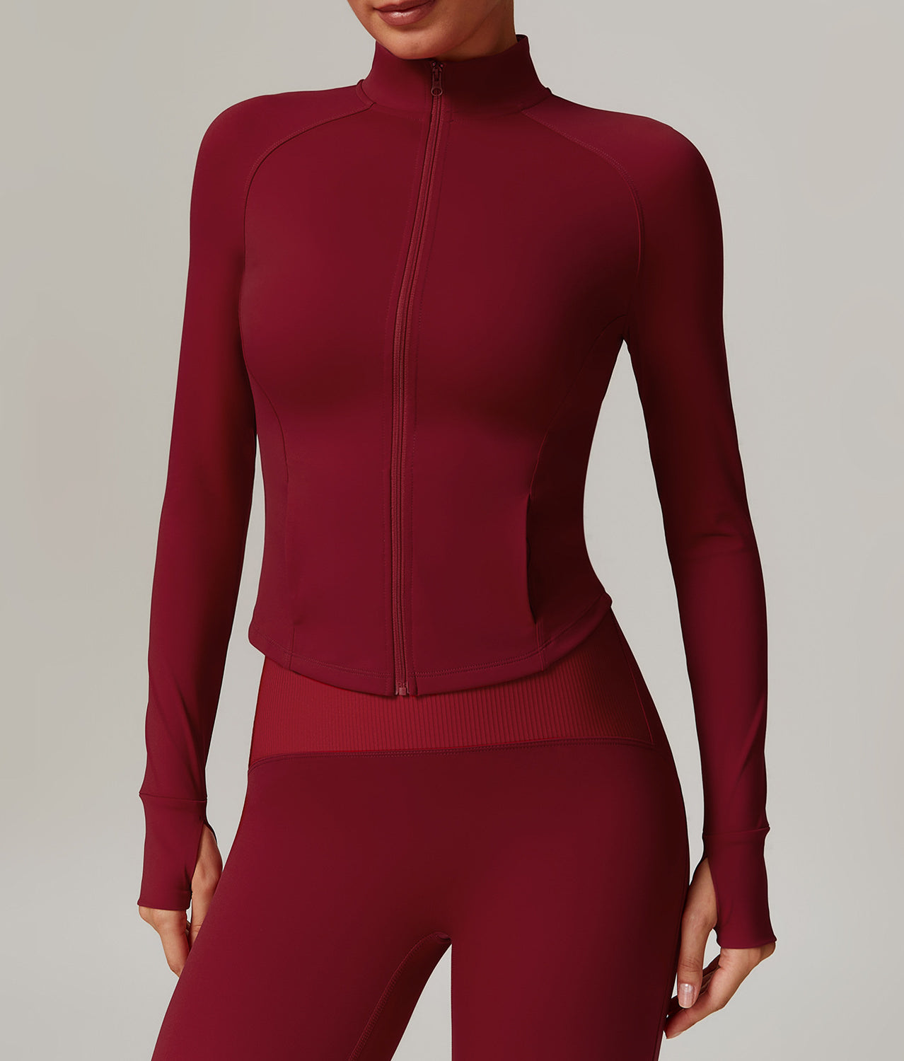 Burgundy long-sleeved athletic zip-up top for activewear fashion and ملابس comfort