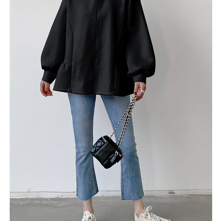 Woman in black peplum hoodie from Letian Ruffled Hooded Jacket, stylish slim fit fashion