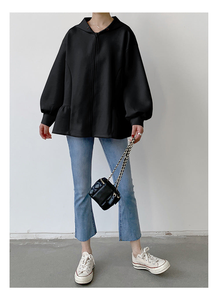 Woman in black peplum hoodie from Letian Ruffled Hooded Jacket, stylish slim fit fashion