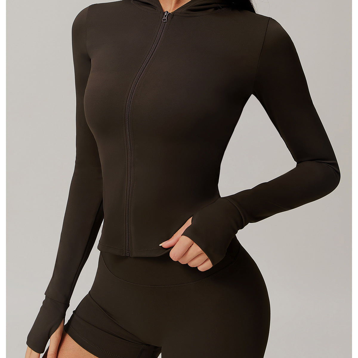 Dark brown long-sleeved athletic romper with zip front and fitted shorts for stylish ملابس
