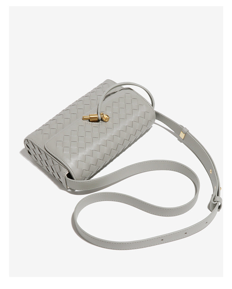 Gray woven leather crossbody bag with gold clasp, perfect for stylish fashion looks