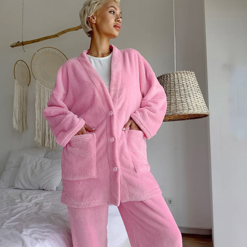 Cozy pink fleece pajamas with button-front top and pants, perfect knitting cardigan warm attire