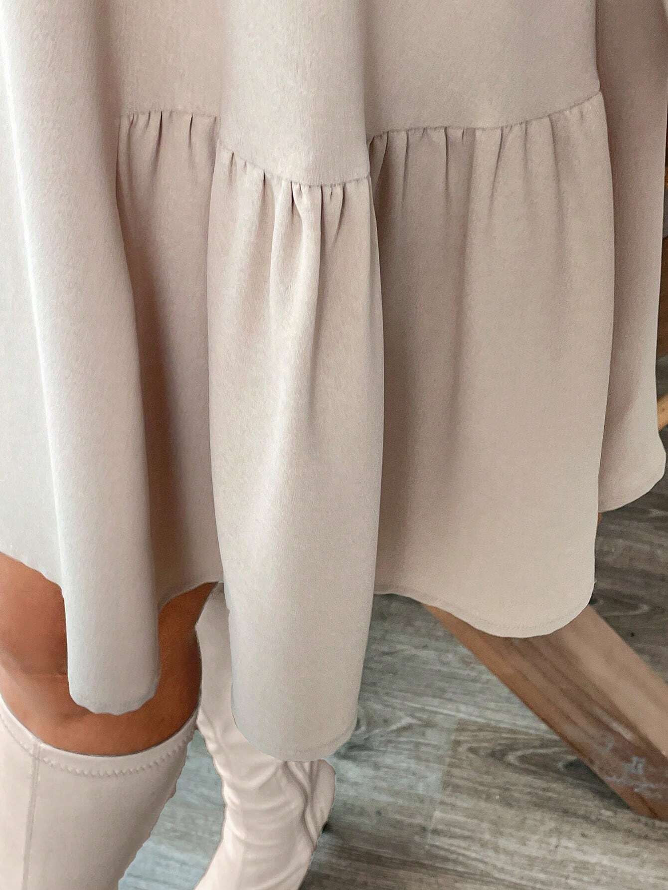 Beige tiered midi dress with long sleeves and ruffled hem for stylish winter fashion