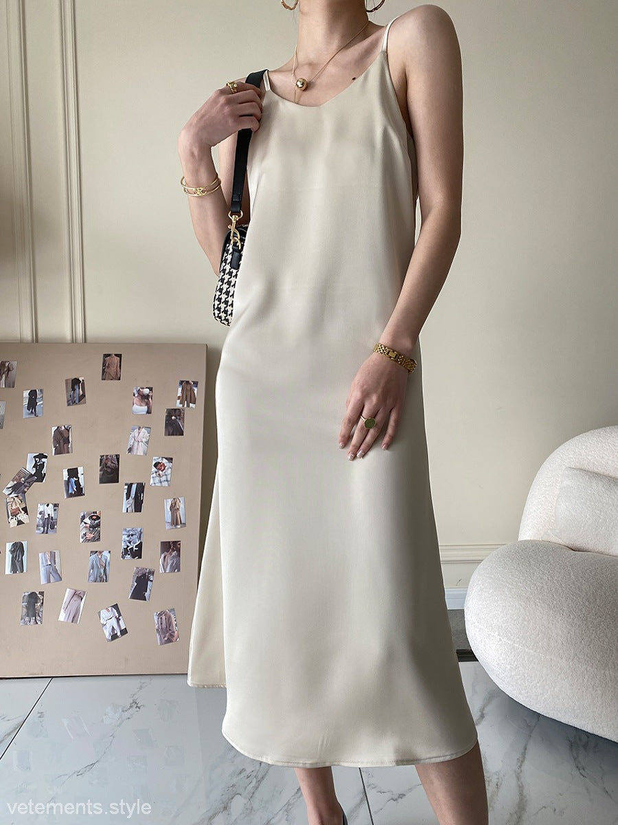 Cream-colored sleeveless French acetate satin dress in minimalist design