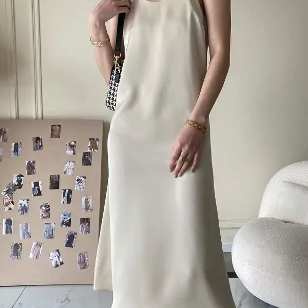 Cream-colored acetate satin dress in minimalist sleeveless midi design