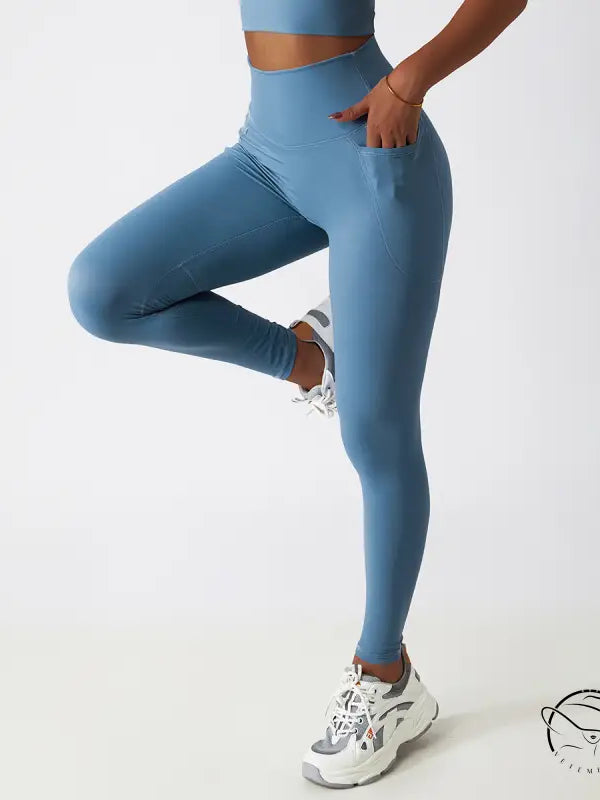 Light blue high-waisted yoga pants with white sneakers, Langry fashion