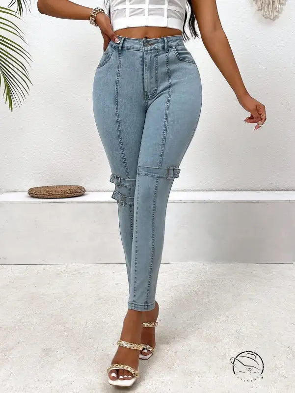 High elastic skinny jeans in light blue with buckle details