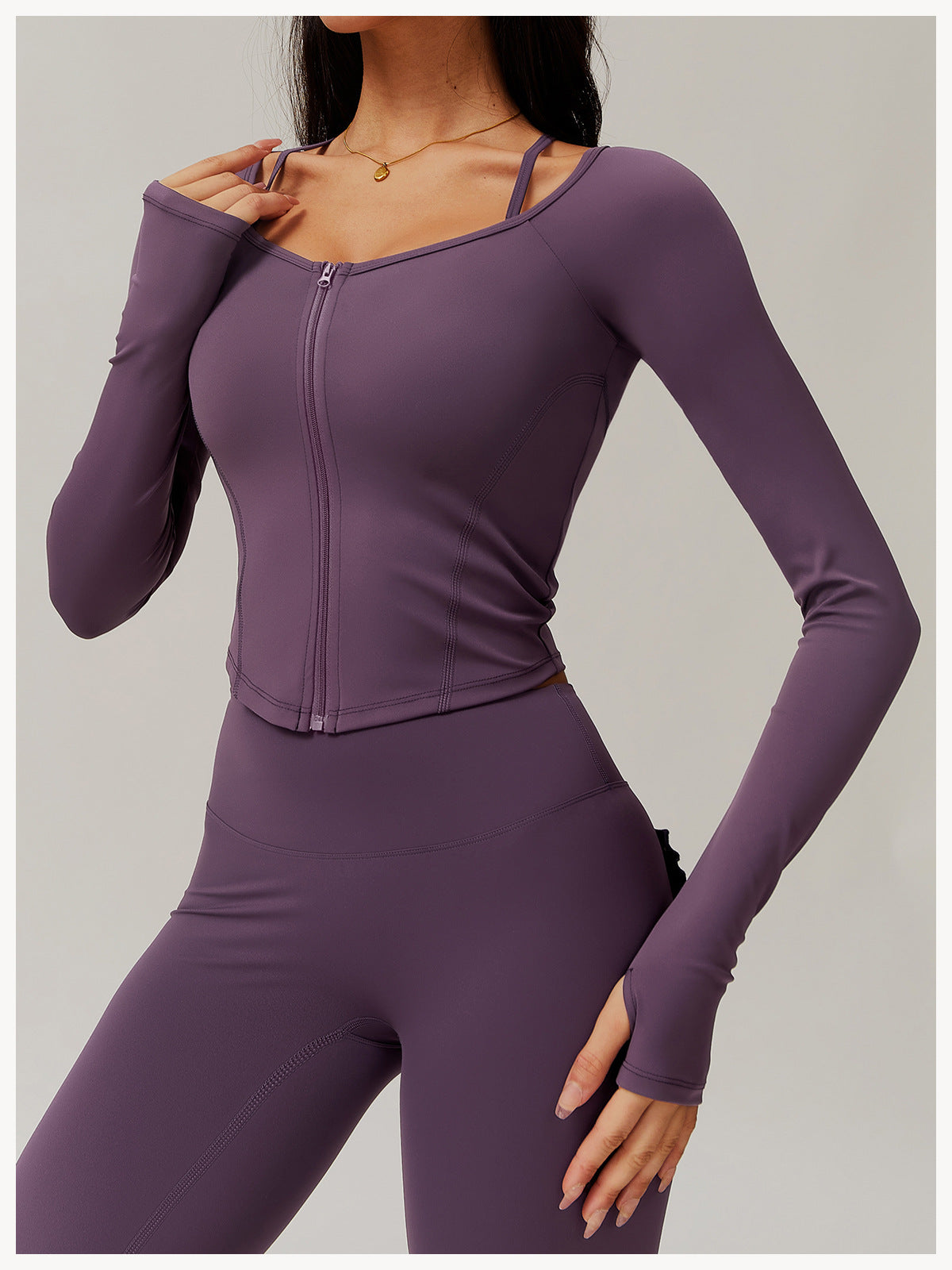 Purple zip-front athletic jumpsuit, perfect for yoga and stylish fitness fashion ملابس