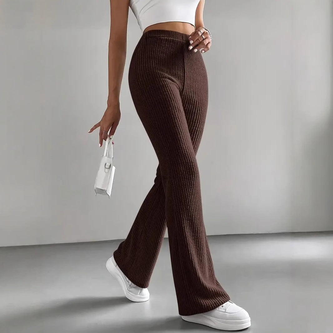 Casual knitted match pants with ribbed flared design, high waist, and white sneakers