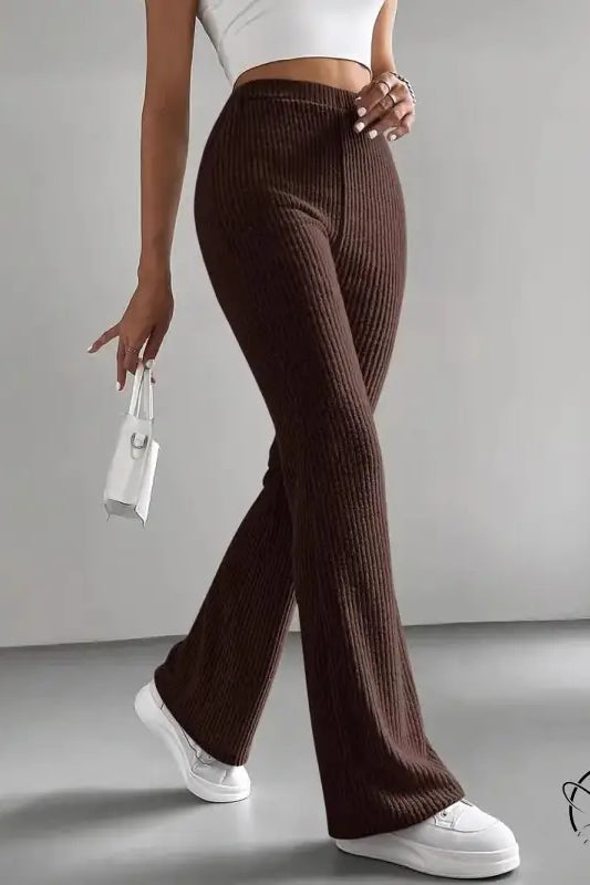 Casual knitted ribbed flared brown match pants with high waist and white sneakers