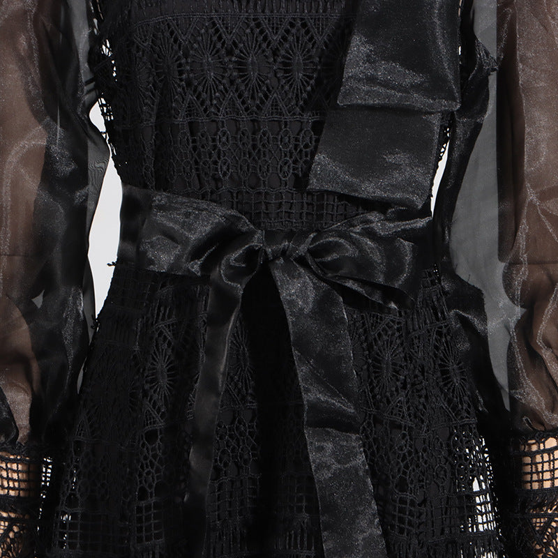 Black lace dress with sheer lantern sleeves and a satin bow in elegant floral design