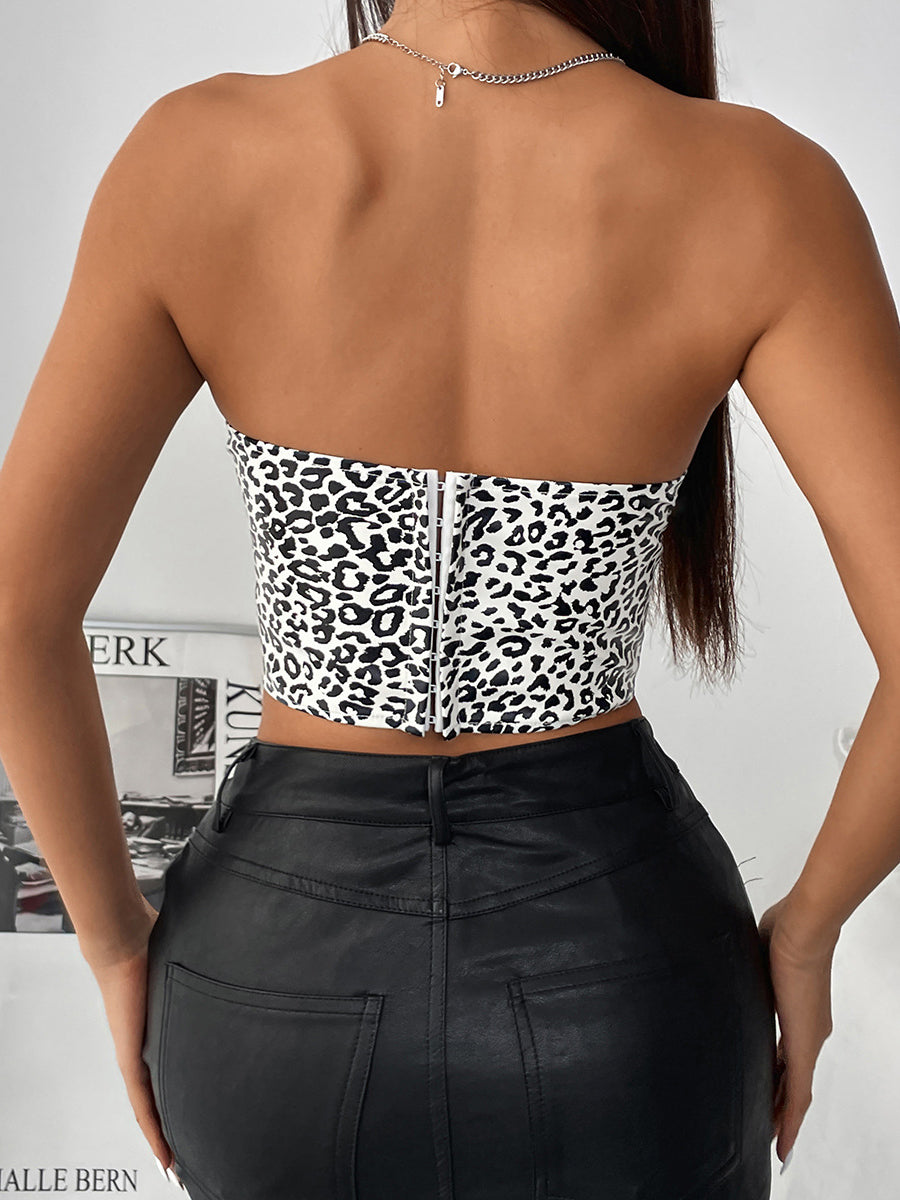 Leopard print wild low cut strapless top paired with black leather pants for a bold look