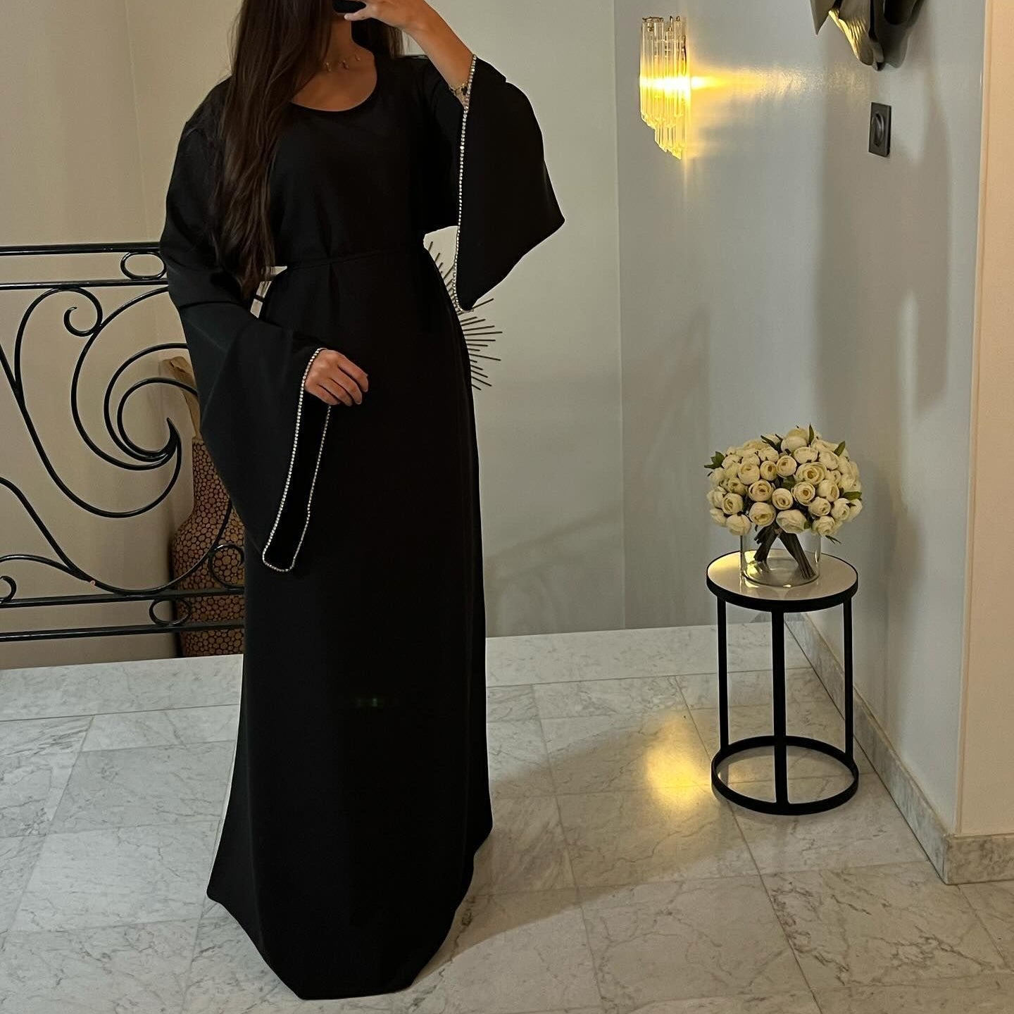 Elegant black abaya with embellished sleeves, perfect for modern fashion and ملابس styling
