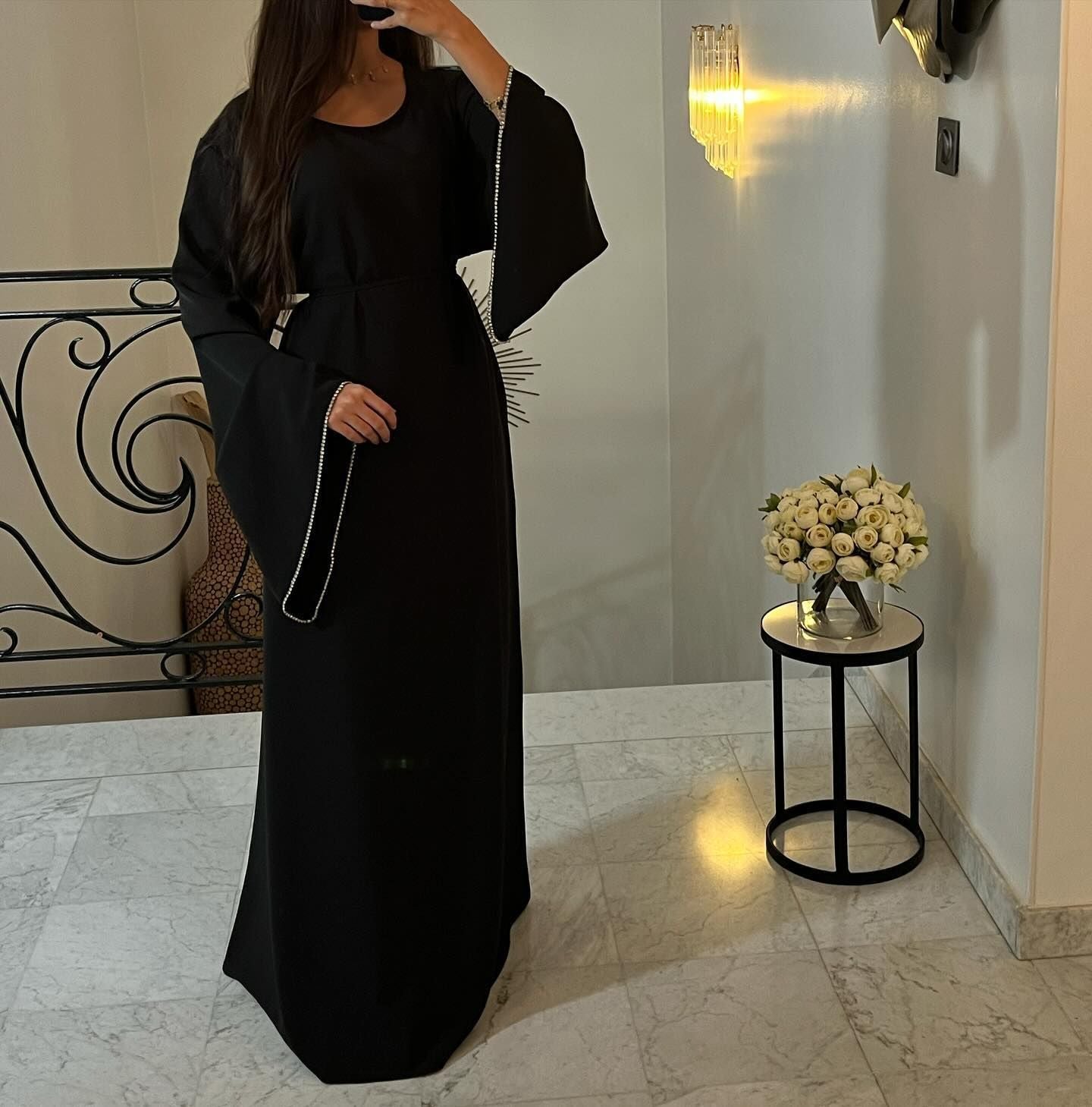Elegant black abaya with embellished sleeves, perfect for modern fashion and ملابس styling