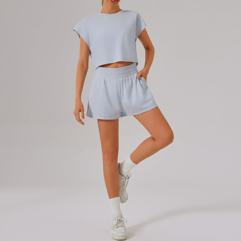 Light blue Loose Sports Yoga Fitness Set with white sneakers and socks for stylish workouts