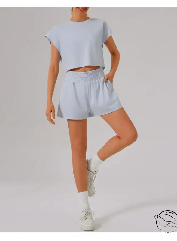 Light blue loose sports yoga fitness set with white sneakers