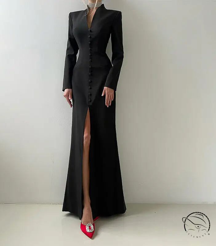 Langry black satin evening gown with high slit, long sleeves, red heels