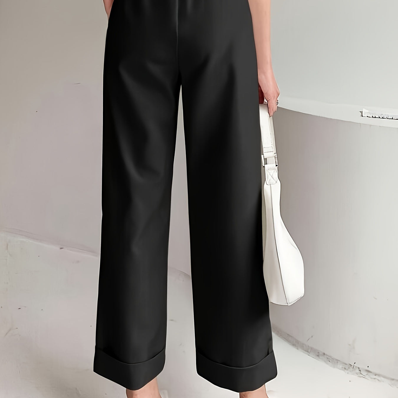 Black wide leg pant with elastic waistband and real pockets for a slimming look