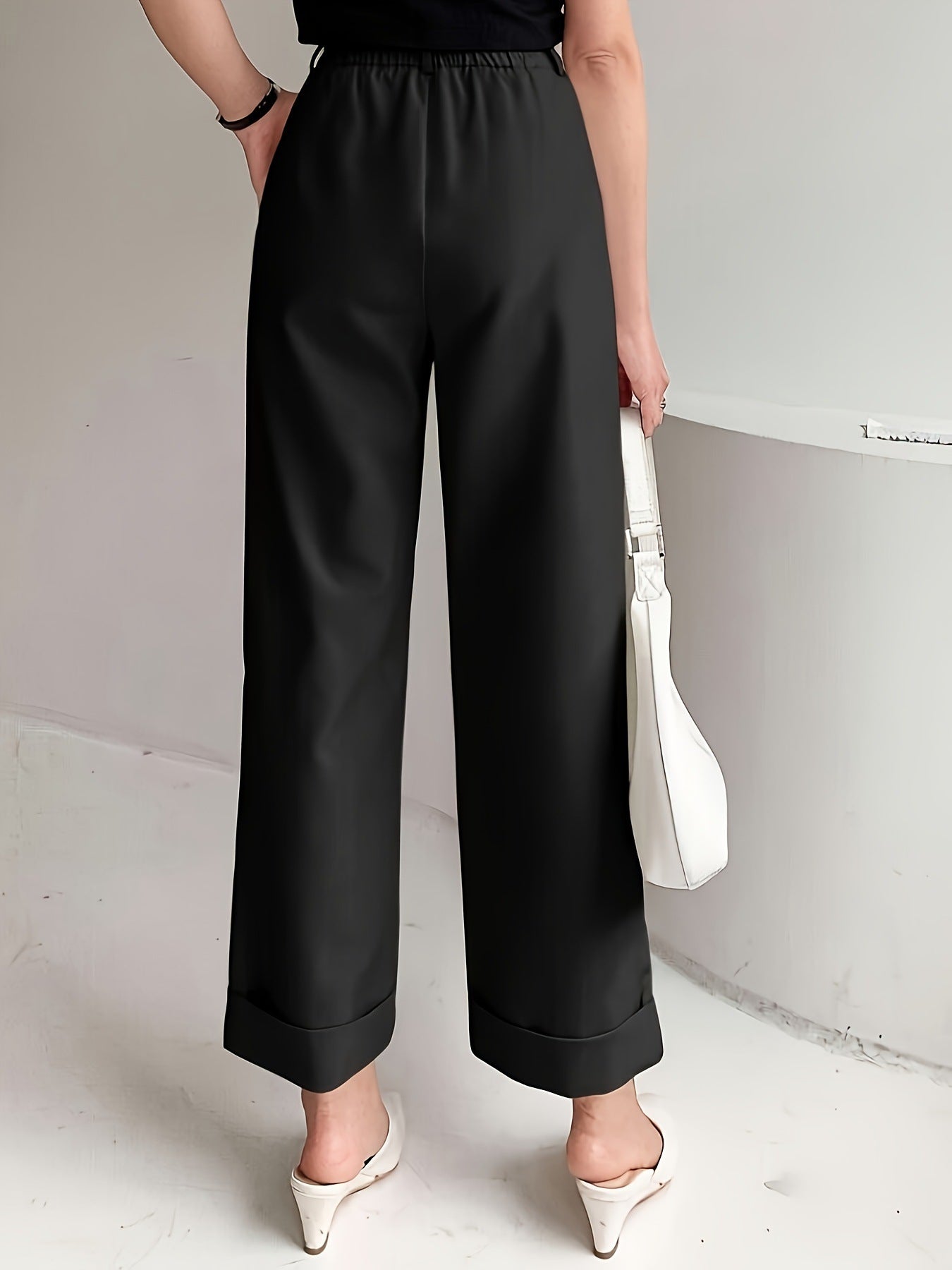 Black wide leg pant with elastic waistband and real pockets for a slimming look
