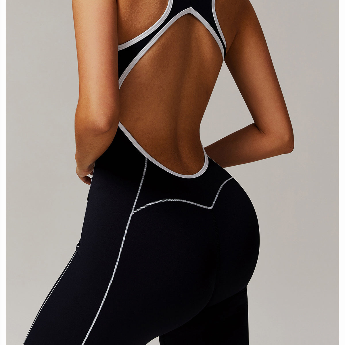 Black and white athletic jumpsuit for stylish fitness, ideal in Langry fashion ملابس