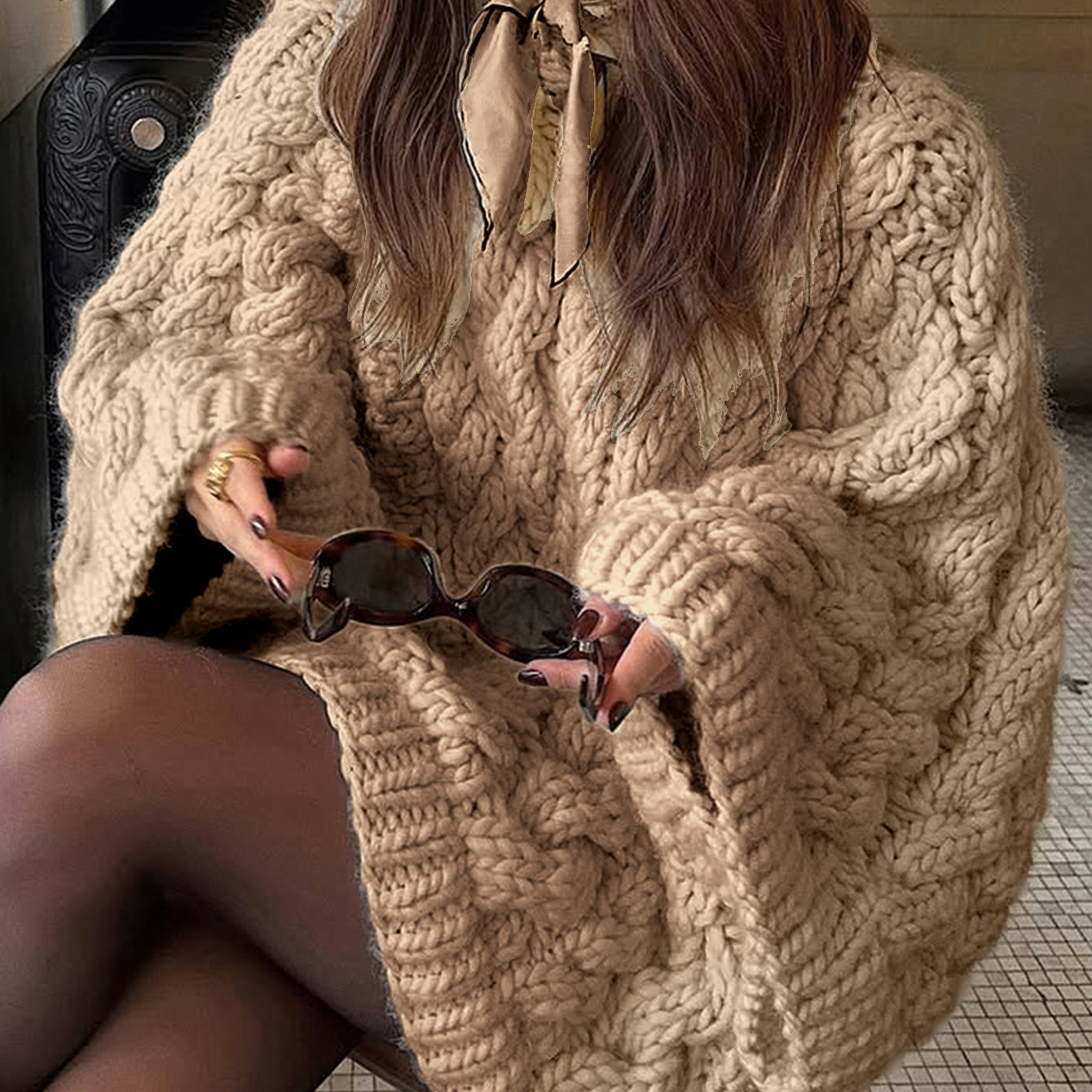 Beige oversized cable knit long sleeve sweater with sunglasses